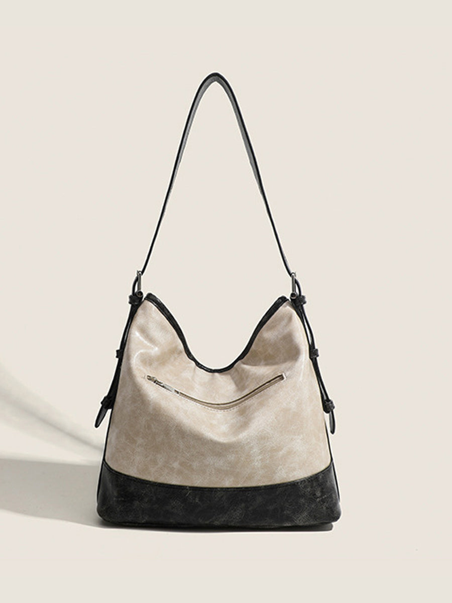 Fashionable women's handbag in color blocks