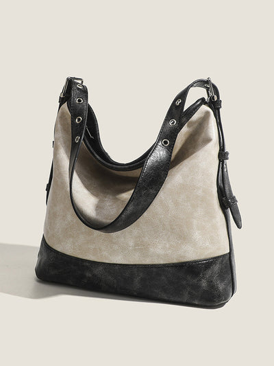 Fashionable women's handbag in color blocks