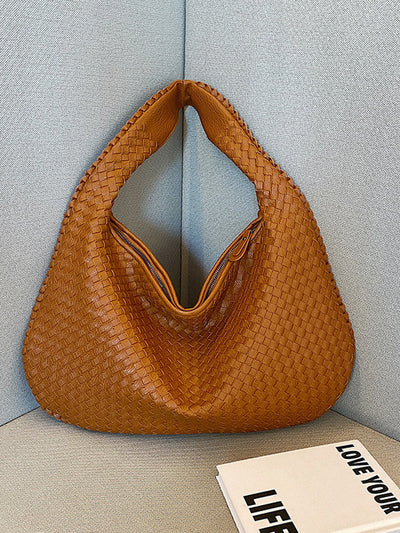 Fashionable woven leather handbag
