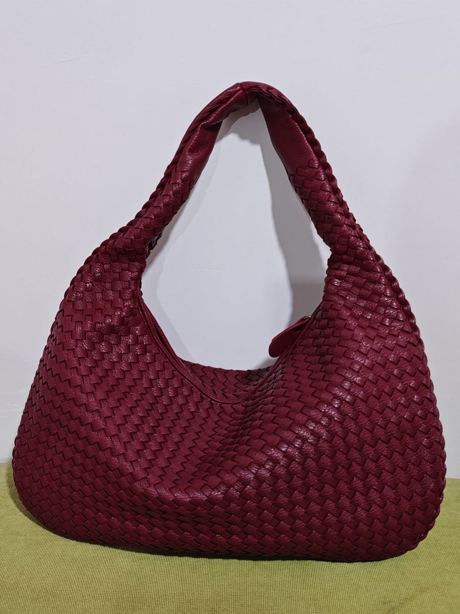 Fashionable woven leather handbag