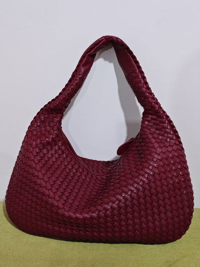Fashionable woven leather handbag