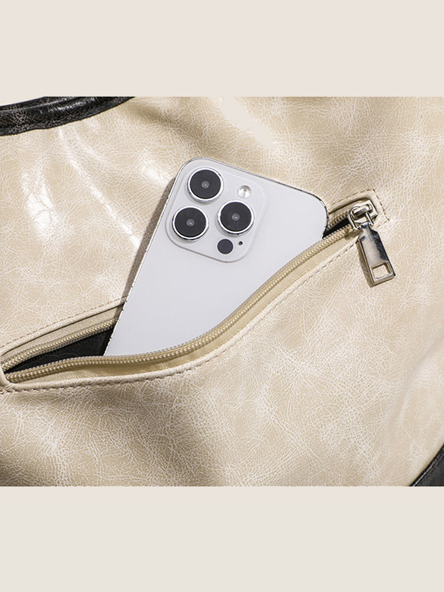 Fashionable women's handbag in color blocks