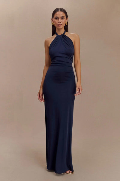 KLARA | Dress with curves and halter neck.