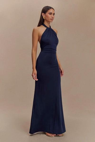 KLARA | Dress with curves and halter neck.