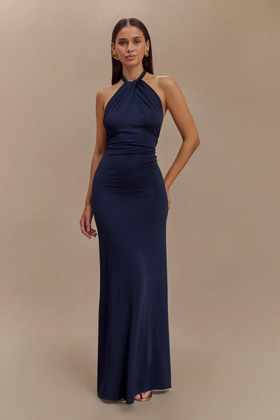 KLARA | Dress with curves and halter neck.
